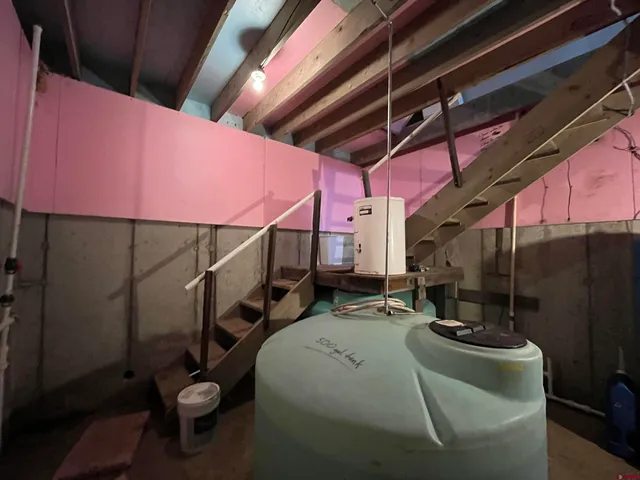 a bedroom with furniture and a table