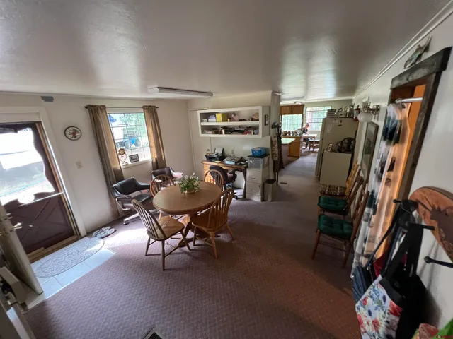 a view of a livingroom and dining room