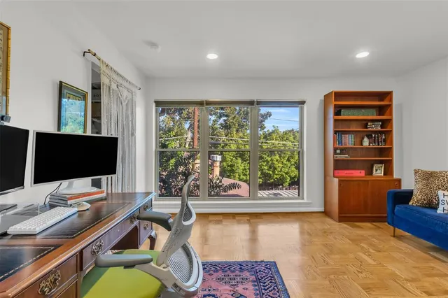 a workspace with furniture and window