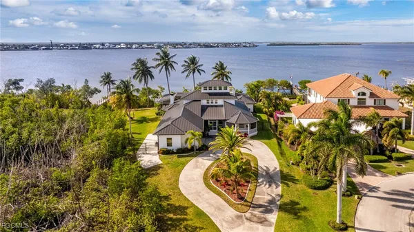 an aerial view of a house with garden space and street view