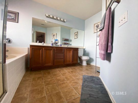 1109 Rebecca Avenue Ridgecrest, CA 93555 - Photo 36 of 50 a bathroom with a sink a toilet and bathtub