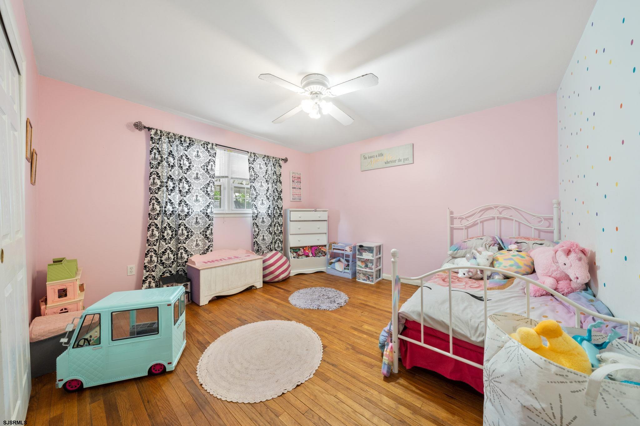 40 Gulph Mill Road Somers Point, NJ 08244 - Photo 14 of 21 a bedroom with furniture and a wooden floor