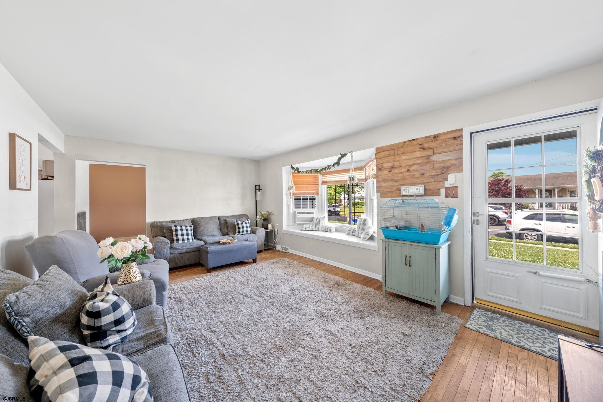 40 Gulph Mill Road Somers Point, NJ 08244 - Photo 5 of 21 a living room with furniture and a large window