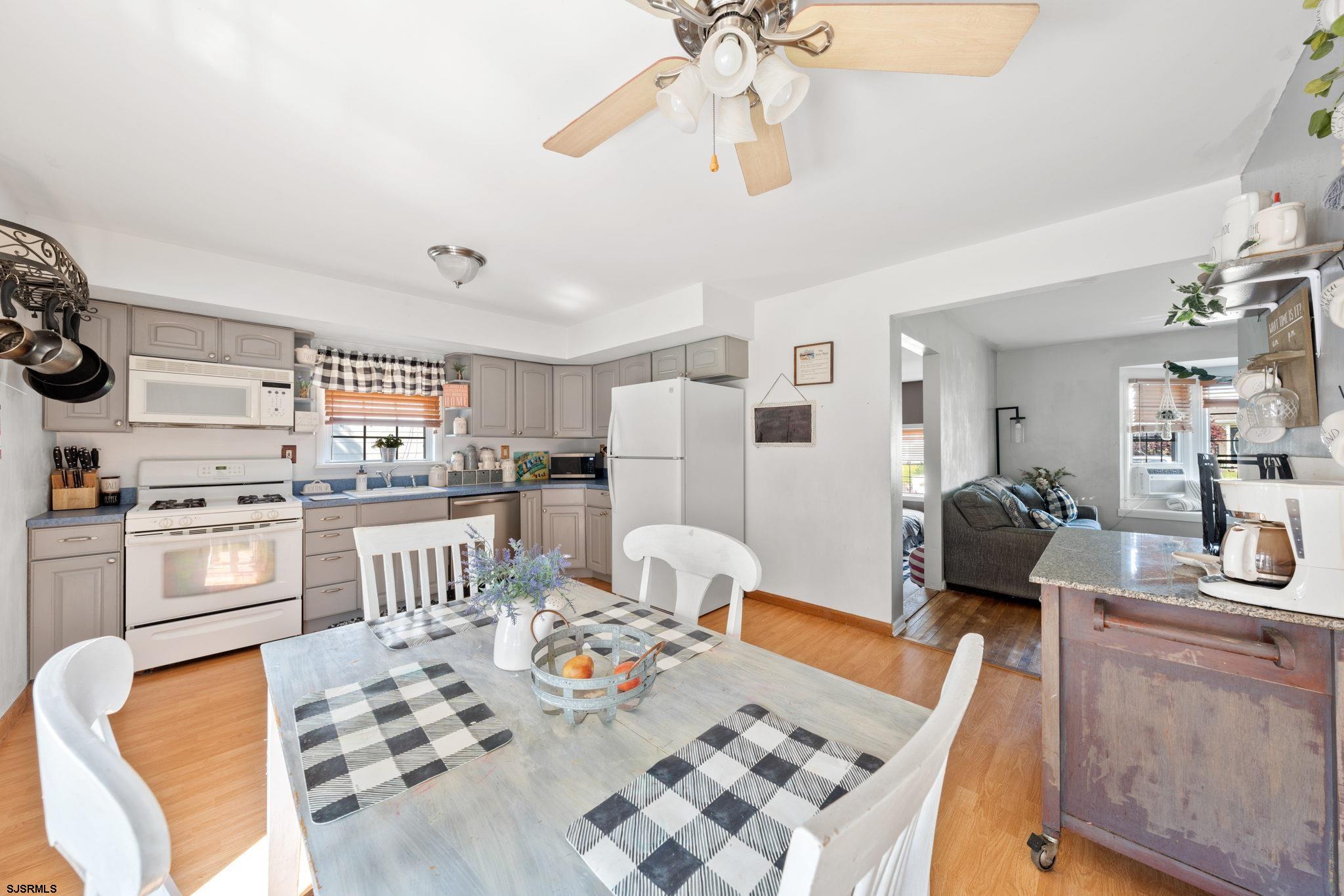 40 Gulph Mill Road Somers Point, NJ 08244 - Photo 7 of 21 a living room with stainless steel appliances kitchen island granite countertop furniture and a view of kitchen
