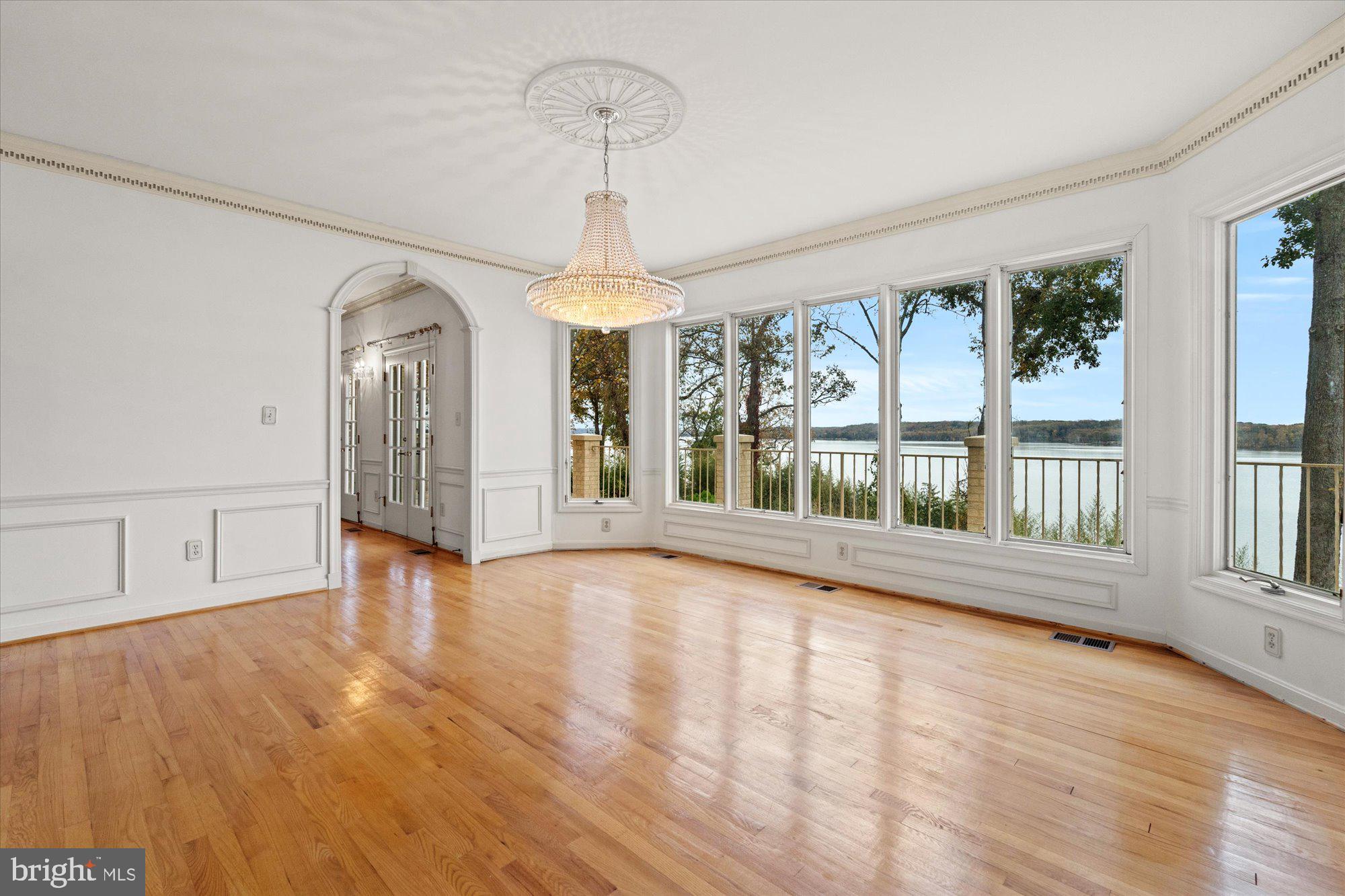 3901 Belle Rive Terrace Alexandria, VA 22309 - Photo 11 of 31 a view of an empty room with wooden floor and a window
