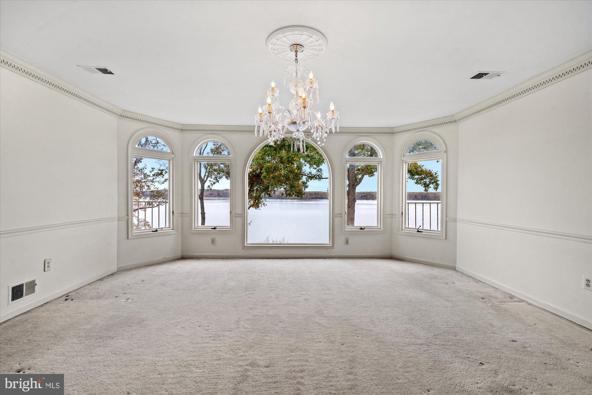 3901 Belle Rive Terrace Alexandria, VA 22309 - Photo 18 of 31 a big room with chandelier and a window