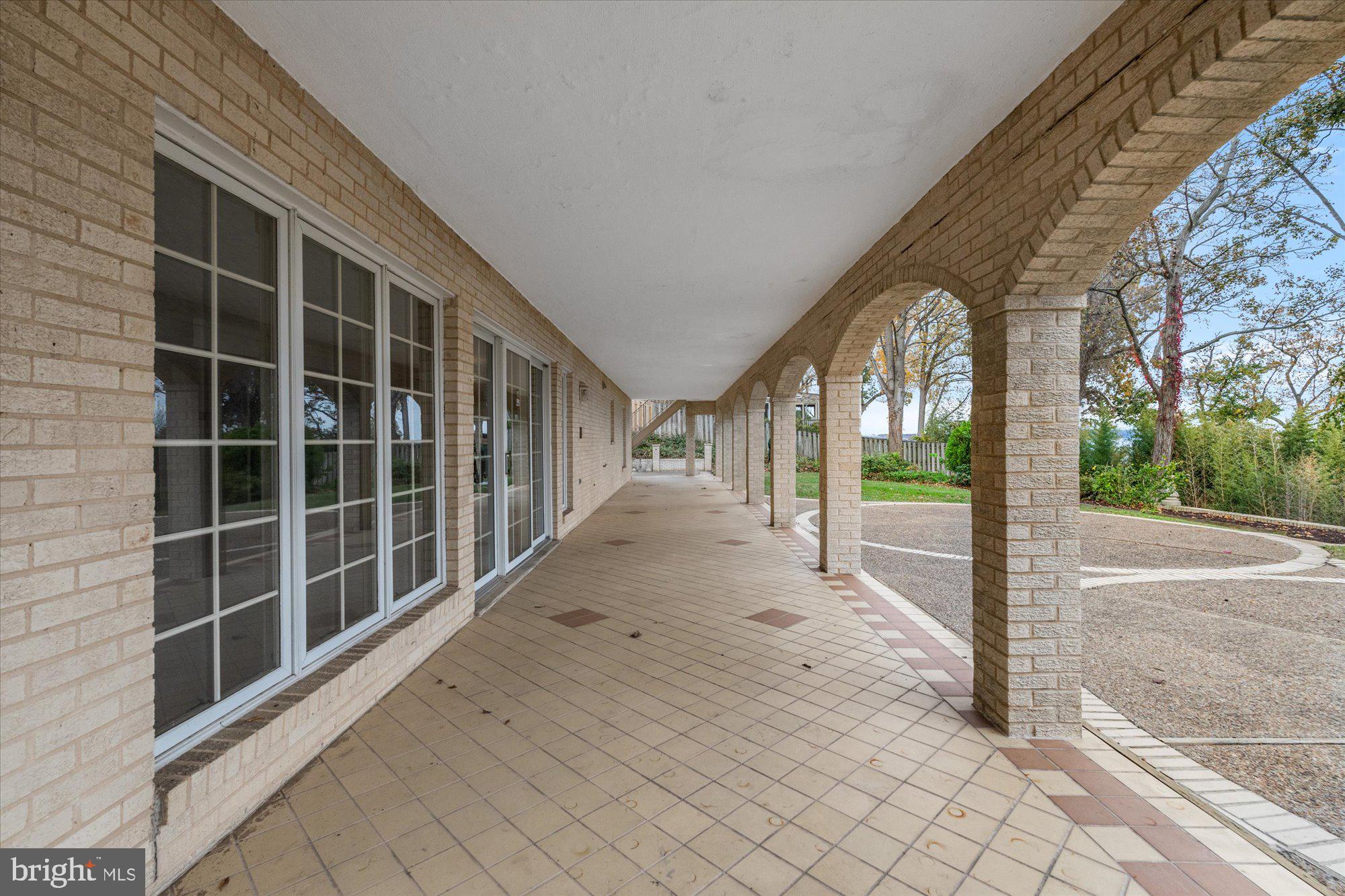 3901 Belle Rive Terrace Alexandria, VA 22309 - Photo 22 of 31 a view of a house with a large window and wooden fence