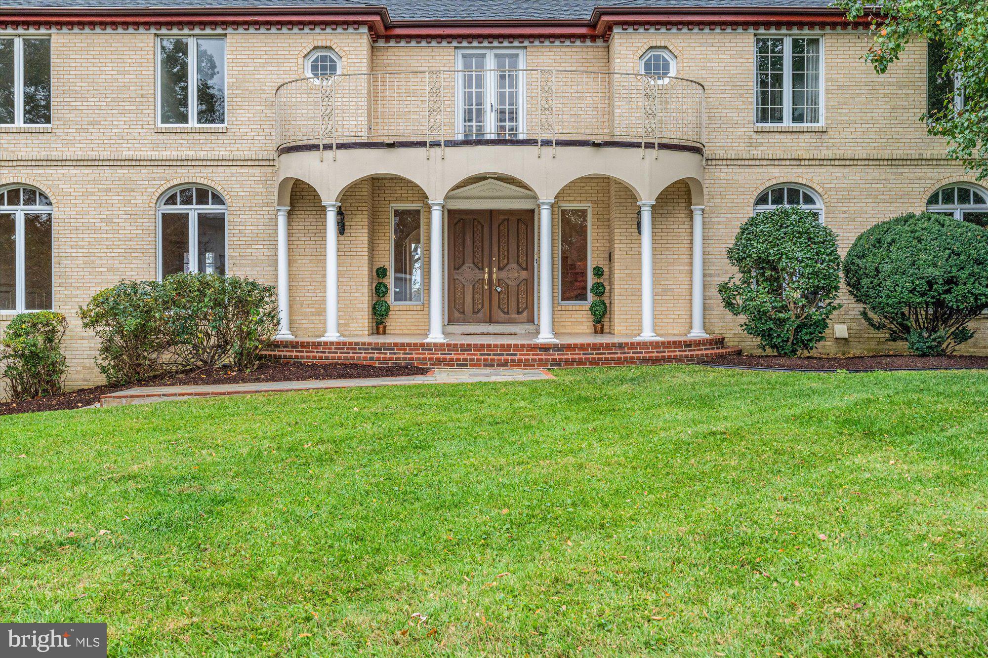 3901 Belle Rive Terrace Alexandria, VA 22309 - Photo 3 of 31 a front view of a house with a yard