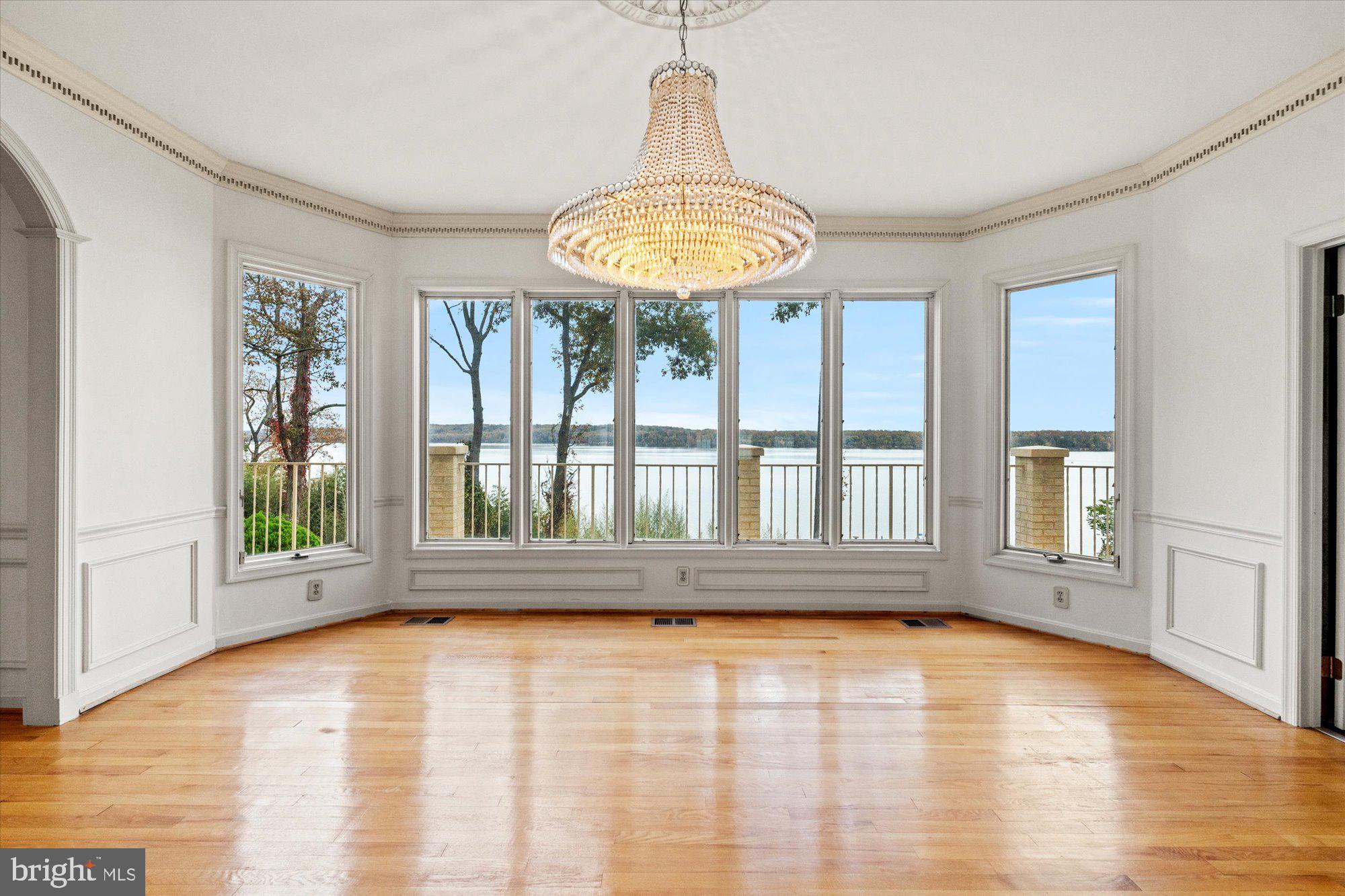 3901 Belle Rive Terrace Alexandria, VA 22309 - Photo 10 of 31 a view of an empty room with a window and wooden floor