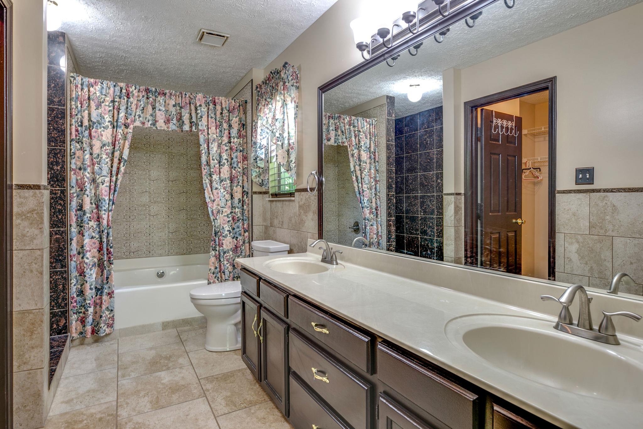 3429 Shakertown Road Antioch, TN 37013 - Photo 14 of 27 Gorgeous Custom Master Bathroom with Large Double Vanities, Deep Jacuzzi Tub & Oversized Walk-in Custom Floor to Ceiling Shower! The Master Bathroom Suite is Complete with a Large Walk-in Closet!