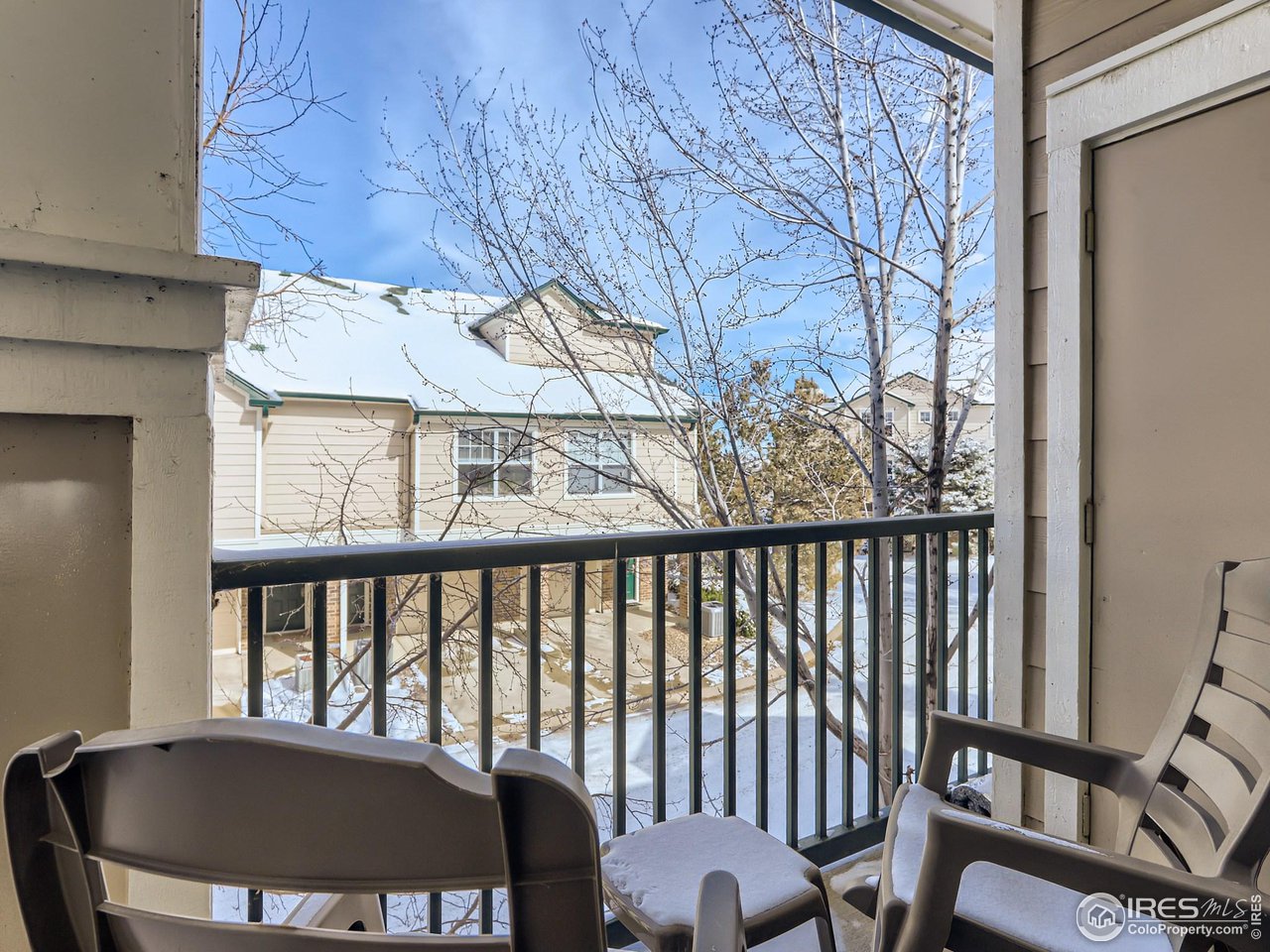 a view of a balcony with furniture