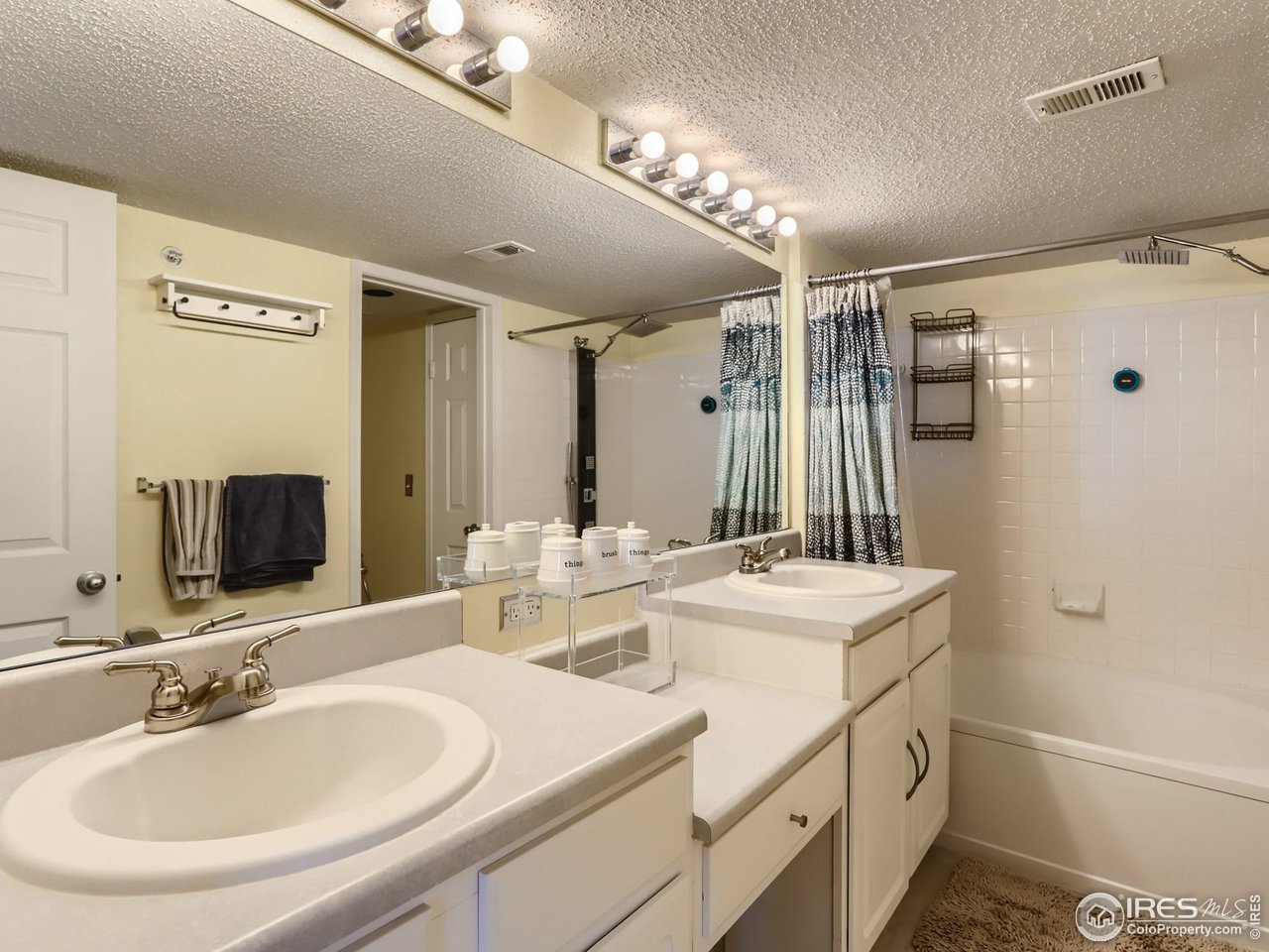 1855 Spaulding Circle Superior, CO 80027 - Photo 11 of 17 a bathroom with a double vanity sink mirror and double