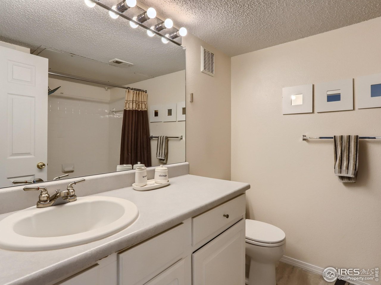 1855 Spaulding Circle Superior, CO 80027 - Photo 7 of 17 a bathroom with a double vanity sink toilet and mirror
