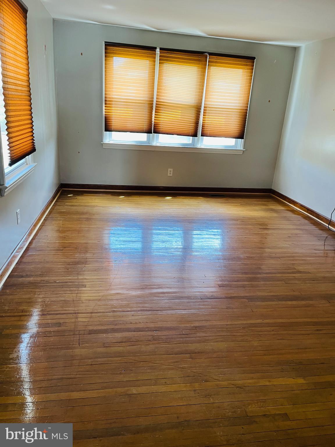 114 South Bishop Avenue Springfield, PA 19064 - Photo 13 of 20 a view of an empty room with wooden floor and a window