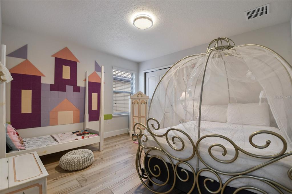 8869 Rhodes Street Kissimmee, FL 34747 - Photo 30 of 66 a bathroom with a granite countertop sink and a mirror