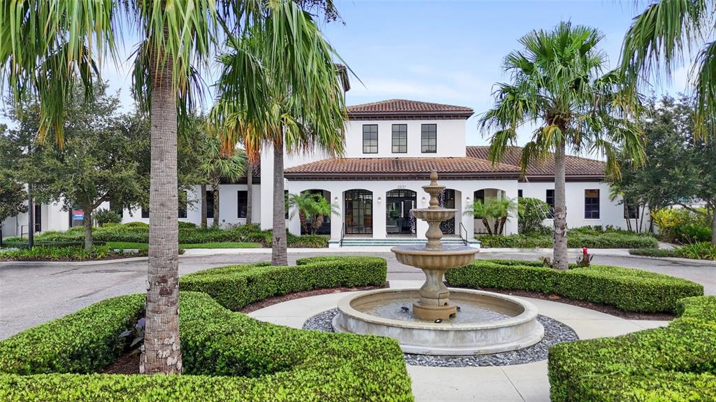 8869 Rhodes Street Kissimmee, FL 34747 - Photo 43 of 66 a front view of a house with a yard and potted plants