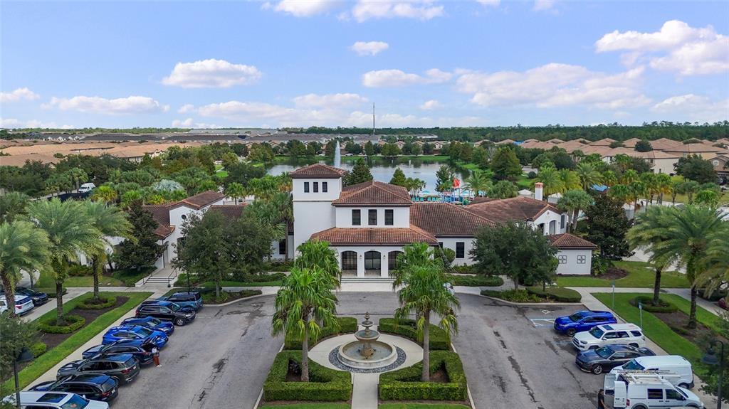 8869 Rhodes Street Kissimmee, FL 34747 - Photo 56 of 66 an aerial view of a house with garden space and street view