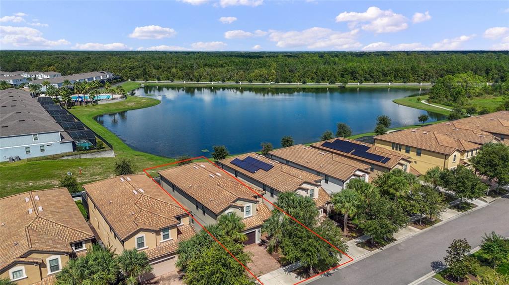 8869 Rhodes Street Kissimmee, FL 34747 - Photo 65 of 66 an aerial view of a house with a lake view