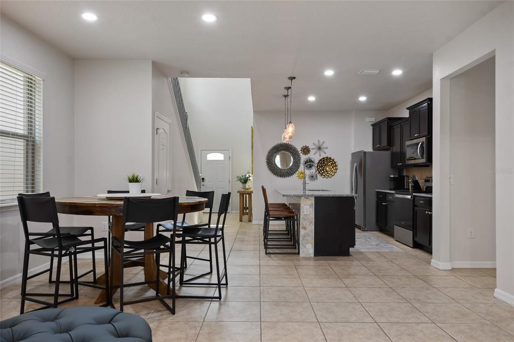 8869 Rhodes Street Kissimmee, FL 34747 - Photo 10 of 66 a view of a dining area with furniture