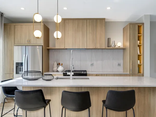 a kitchen with a sink cabinets and window
