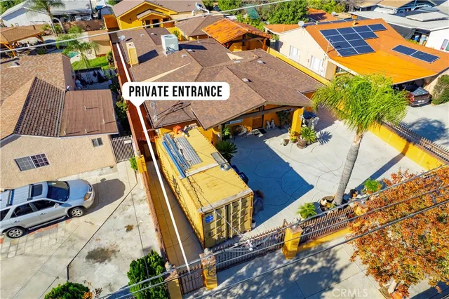 an aerial view of residential houses with outdoor space