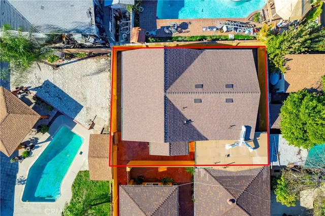 an aerial view of residential houses with outdoor space