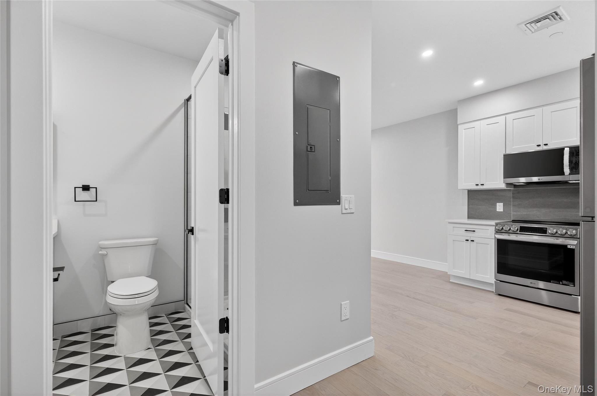 10 Market Street, Unit I Wappingers Falls, NY 12590 - Photo 2 of 26 a bathroom with a sink toilet and shower