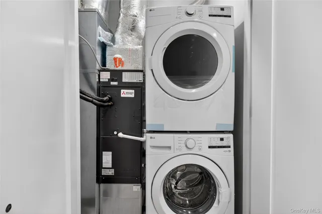 a close view of a utility room with dryer and washer