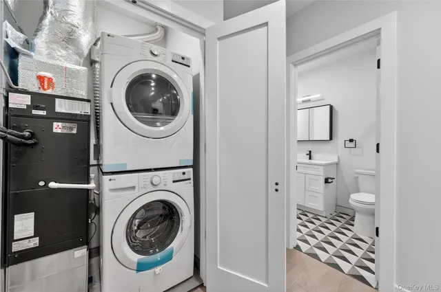 a view of a hallway with washer and dryer