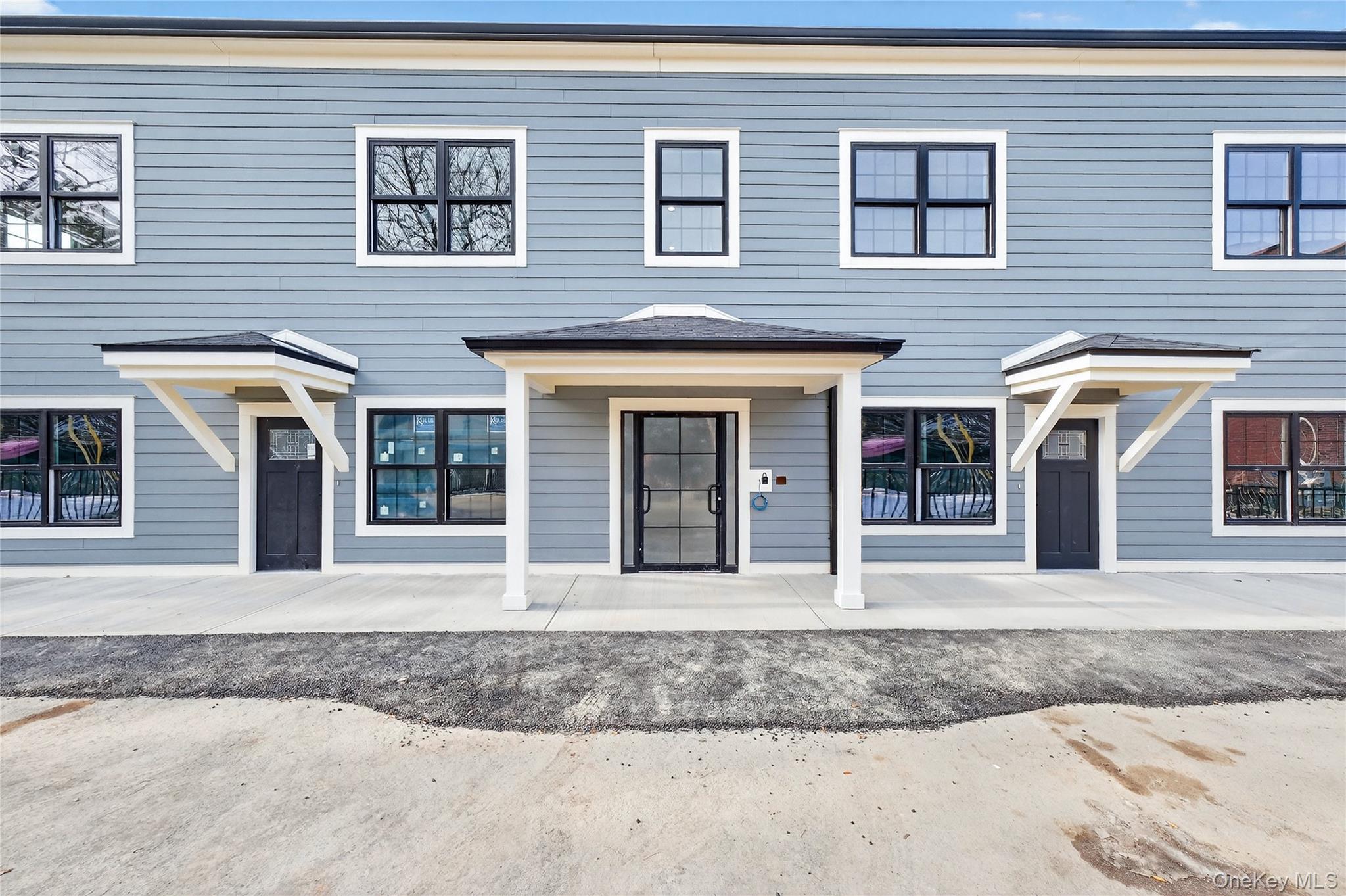 10 Market Street, Unit I Wappingers Falls, NY 12590 - Photo 26 of 26 a front view of a house with a porch
