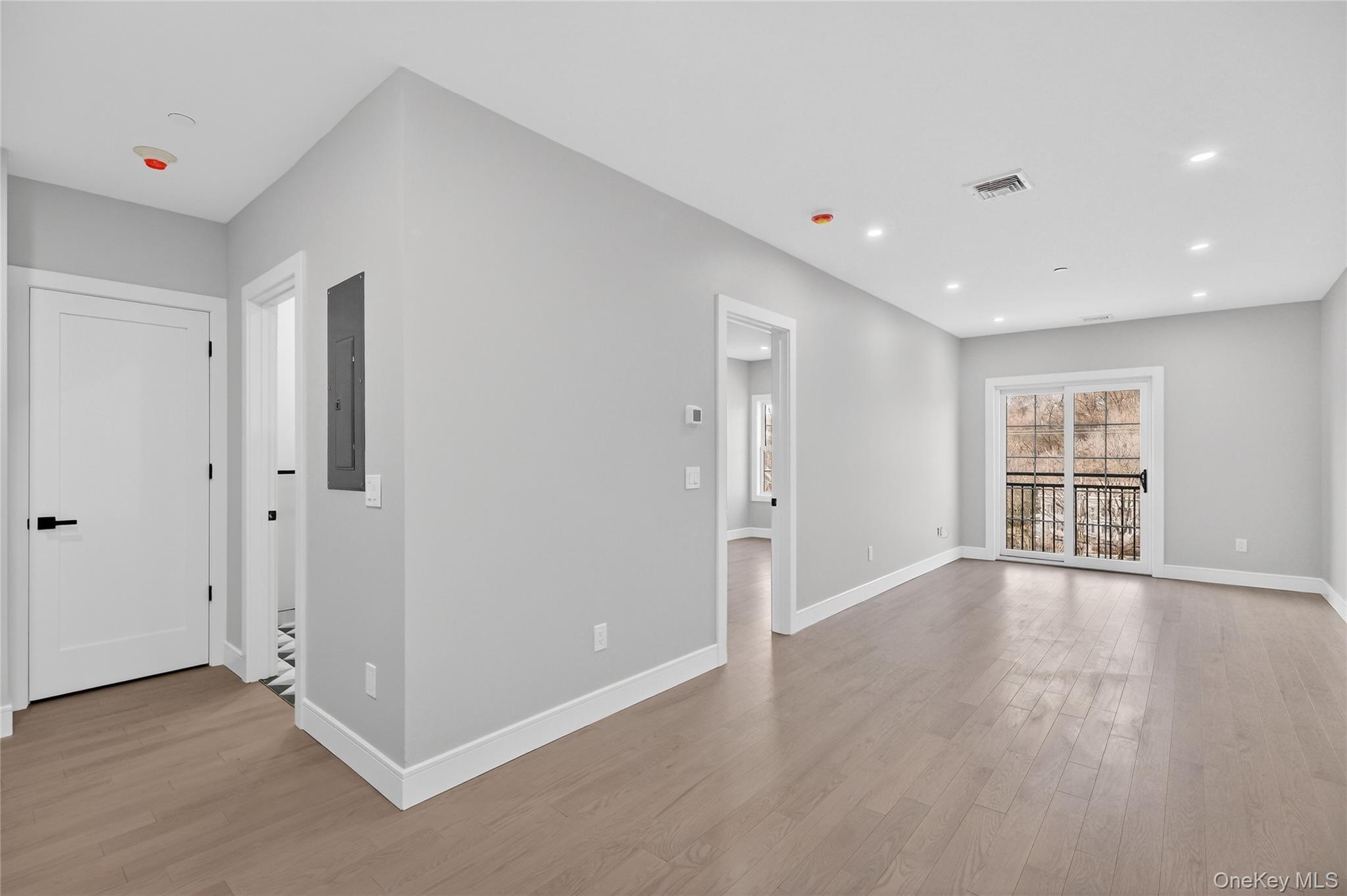 10 Market Street, Unit I Wappingers Falls, NY 12590 - Photo 10 of 26 a view of an empty room with a window and wooden floor