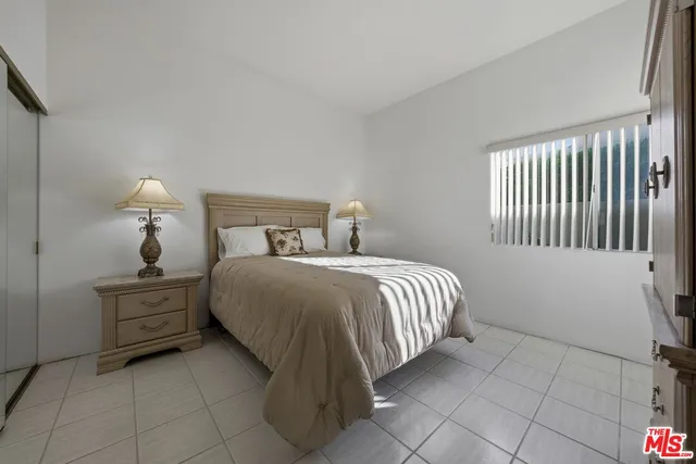 a living room with furniture and a lamp