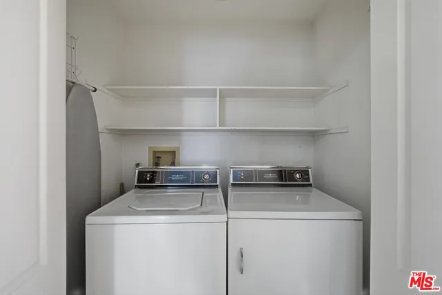 a view of a pathway of a house with a patio