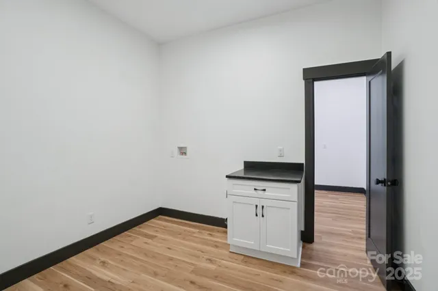 a view of kitchen with wooden floor