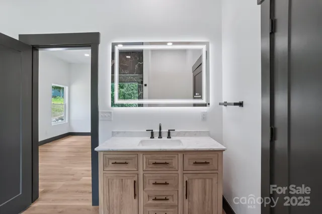 a bathroom with a sink and a mirror