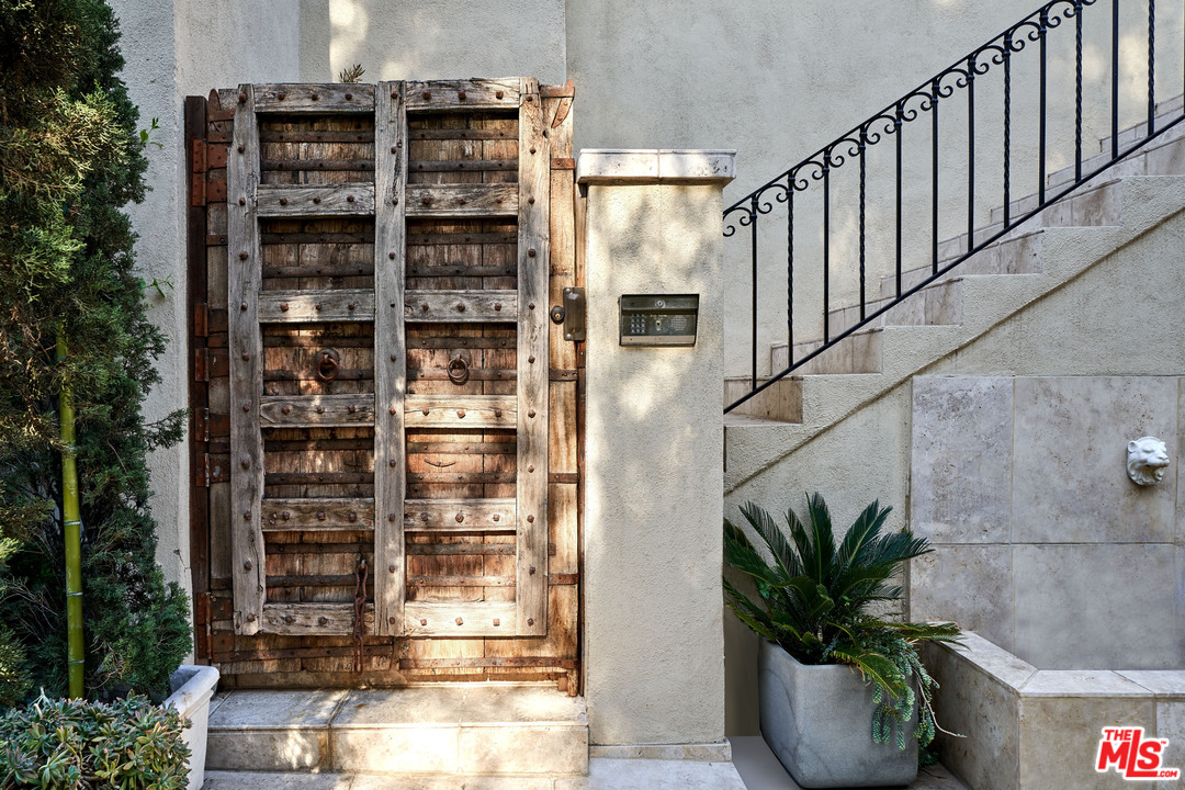 1488 North Kings Road Los Angeles, CA 90069 - Photo 2 of 53 a potted plant sitting in front of a building