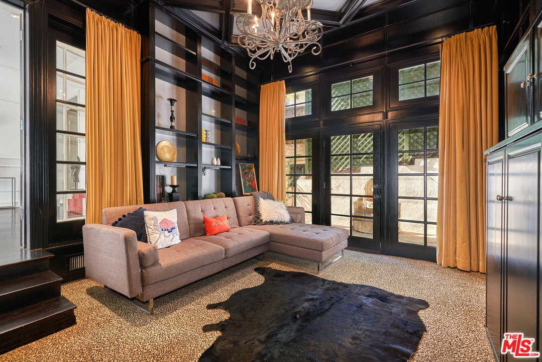 1488 North Kings Road Los Angeles, CA 90069 - Photo 19 of 53 a living room with furniture and a large window