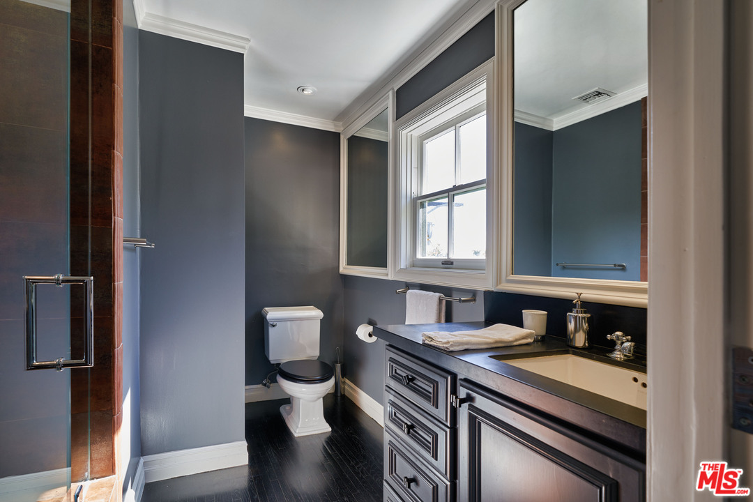 1488 North Kings Road Los Angeles, CA 90069 - Photo 22 of 53 a kitchen with stainless steel appliances granite countertop a stove and a refrigerator