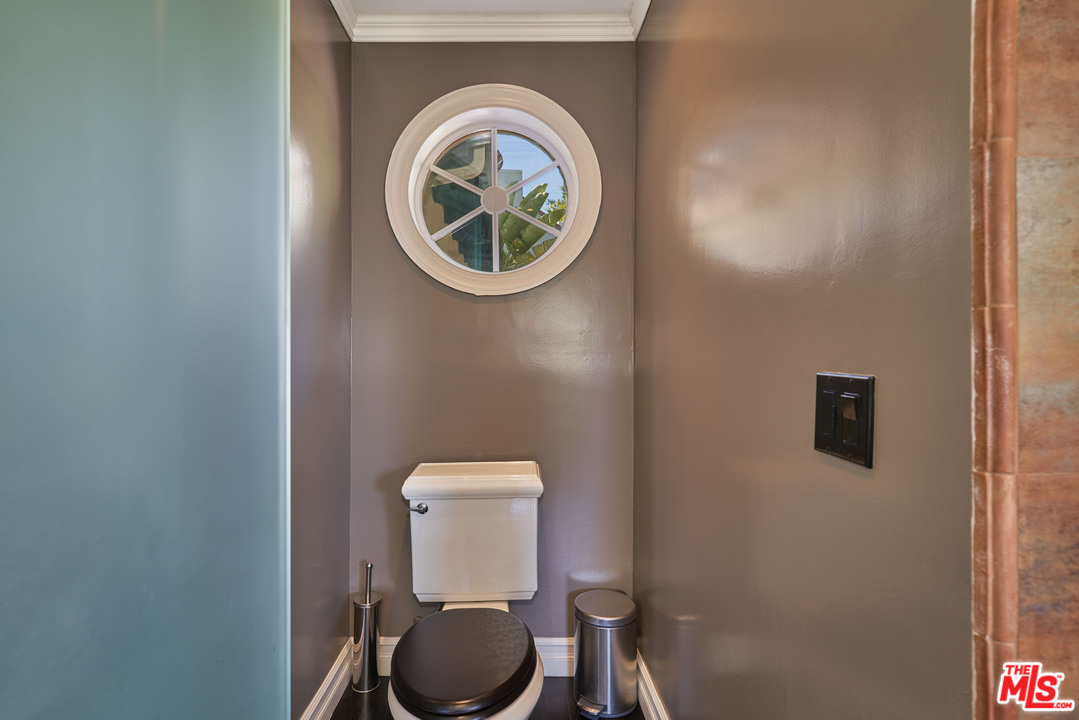 1488 North Kings Road Los Angeles, CA 90069 - Photo 33 of 53 a bathroom with a toilet and a sink