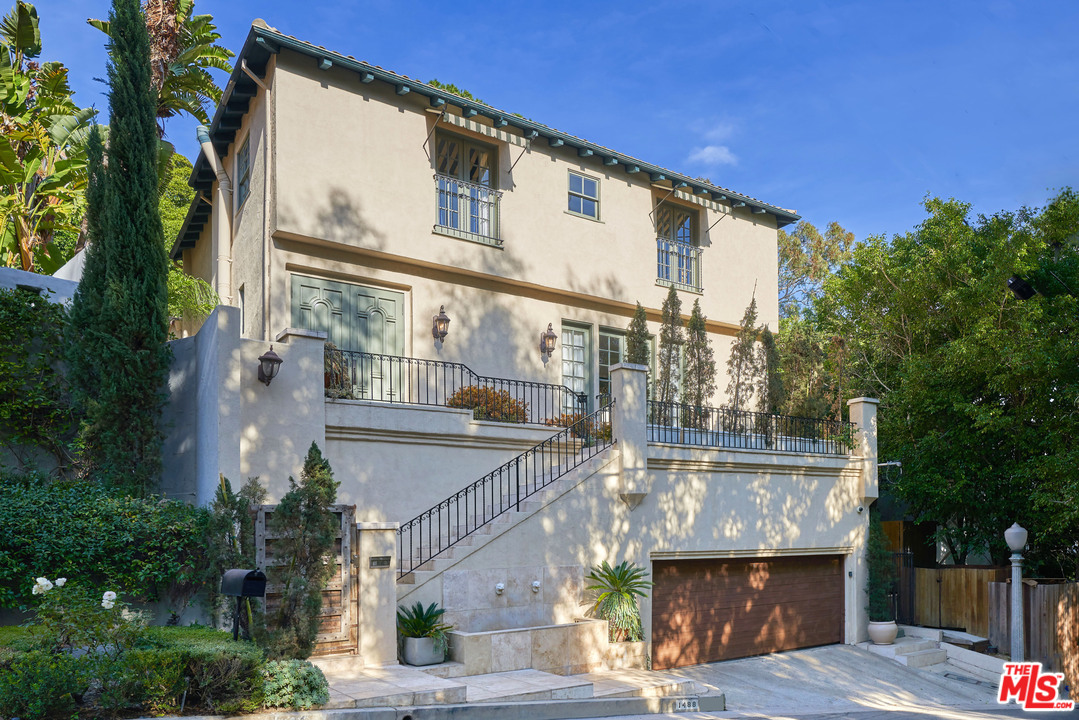 1488 North Kings Road Los Angeles, CA 90069 - Photo 43 of 53 a front view of a building with garden