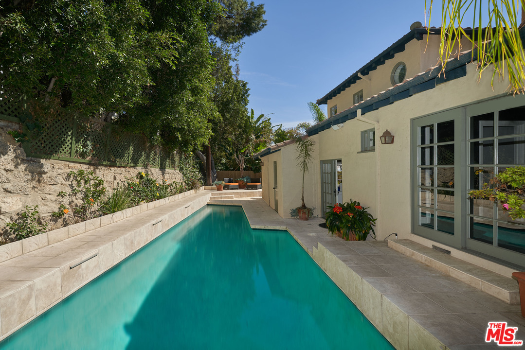 1488 North Kings Road Los Angeles, CA 90069 - Photo 45 of 53 a view of a house with a yard and a patio
