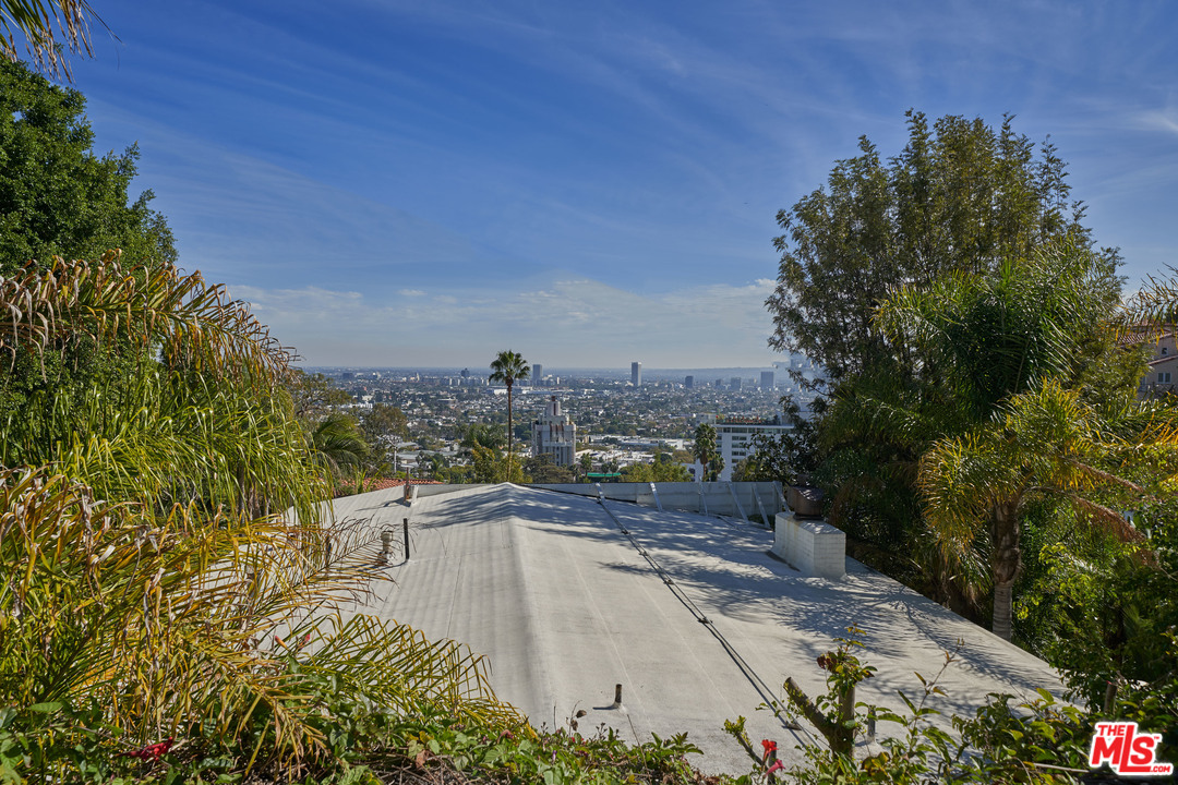1488 North Kings Road Los Angeles, CA 90069 - Photo 51 of 53 a view of a swimming pool with a patio