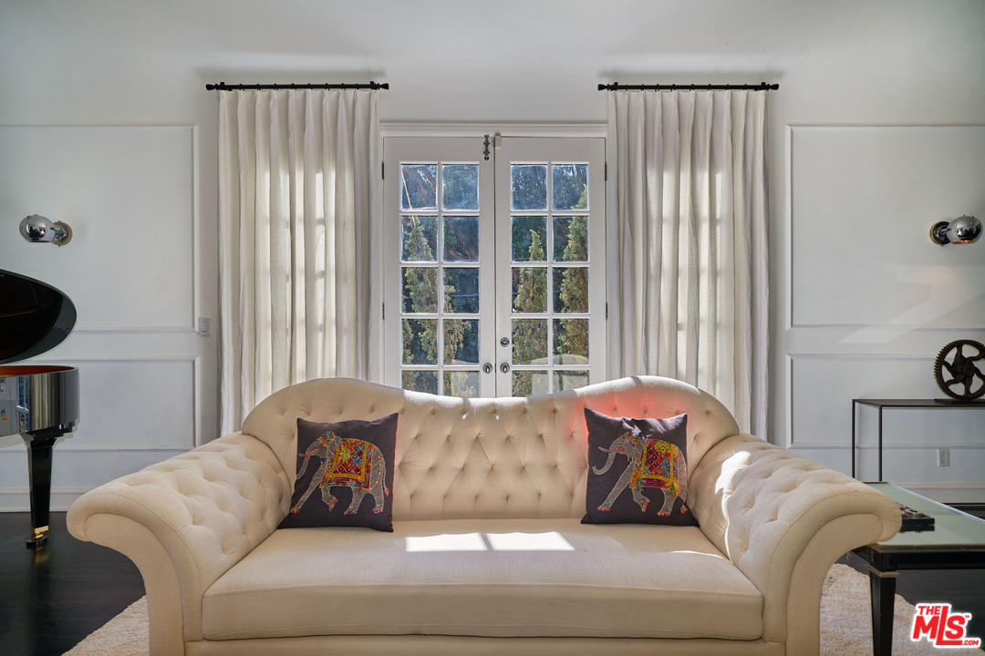 1488 North Kings Road Los Angeles, CA 90069 - Photo 9 of 53 a living room with furniture and a window