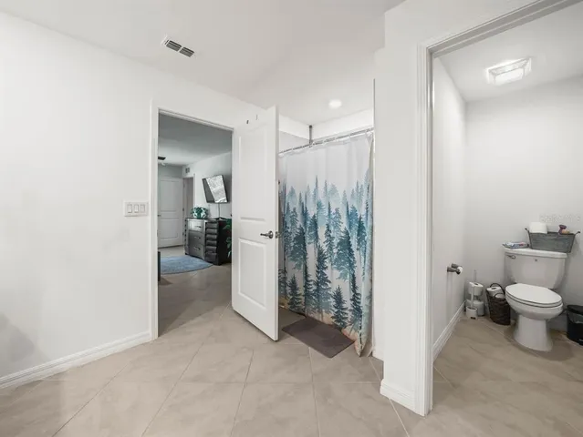 a bathroom with a toilet and a sink