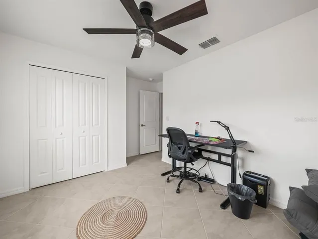 a view of a workspace with furniture