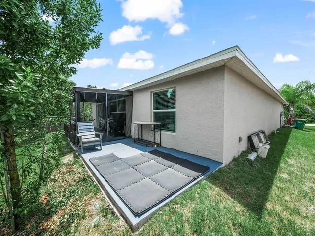 a backyard of a house with seating space