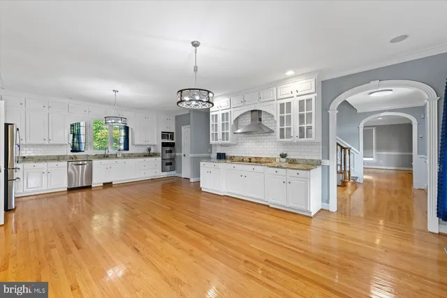 a living room with furniture a table and a window