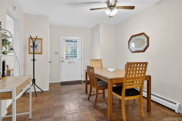 a view of a livingroom with furniture and workspace