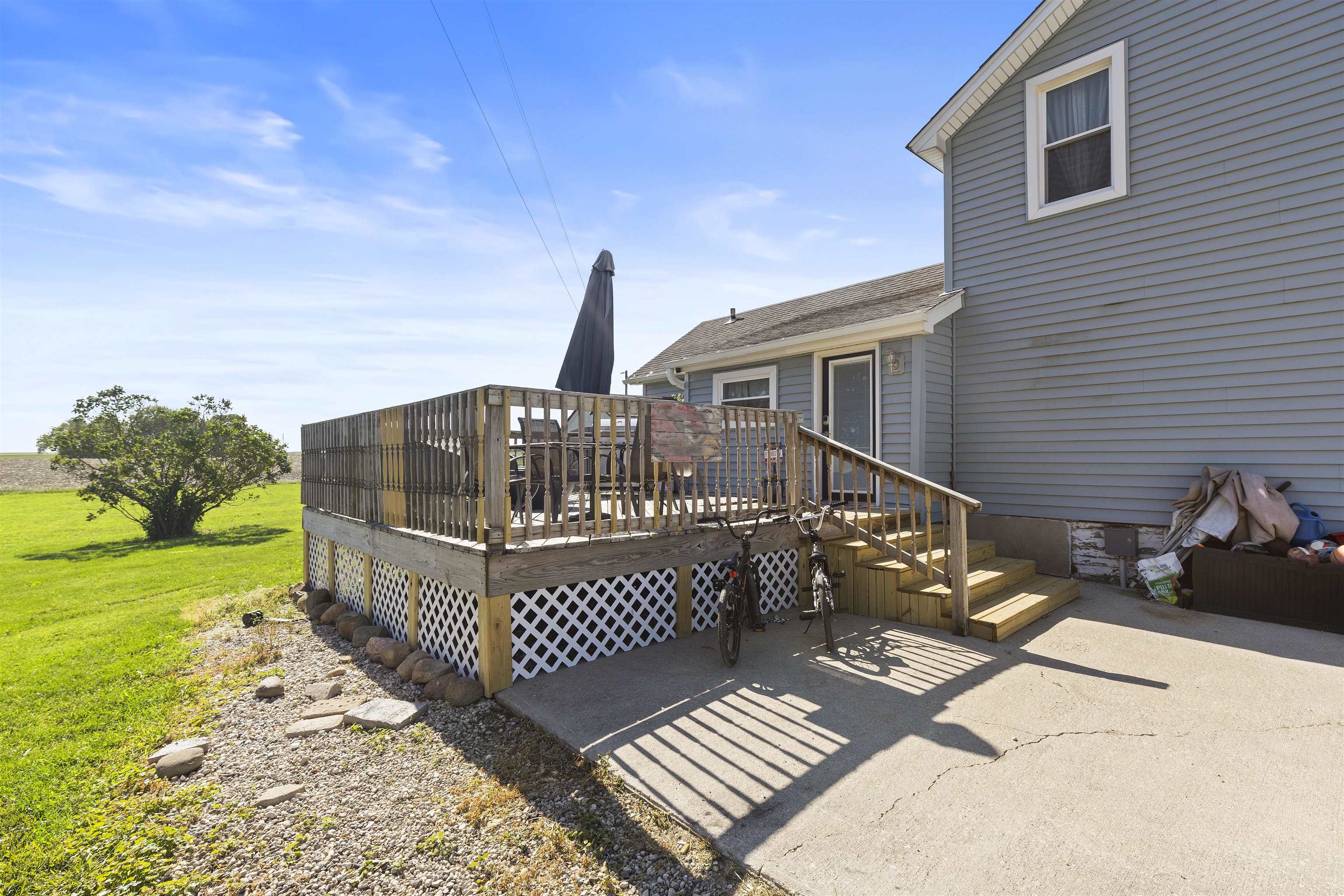 10784 East Utility Road Stillman Valley, IL 61084 - Photo 19 of 23 a view of a deck with wooden floor and fence