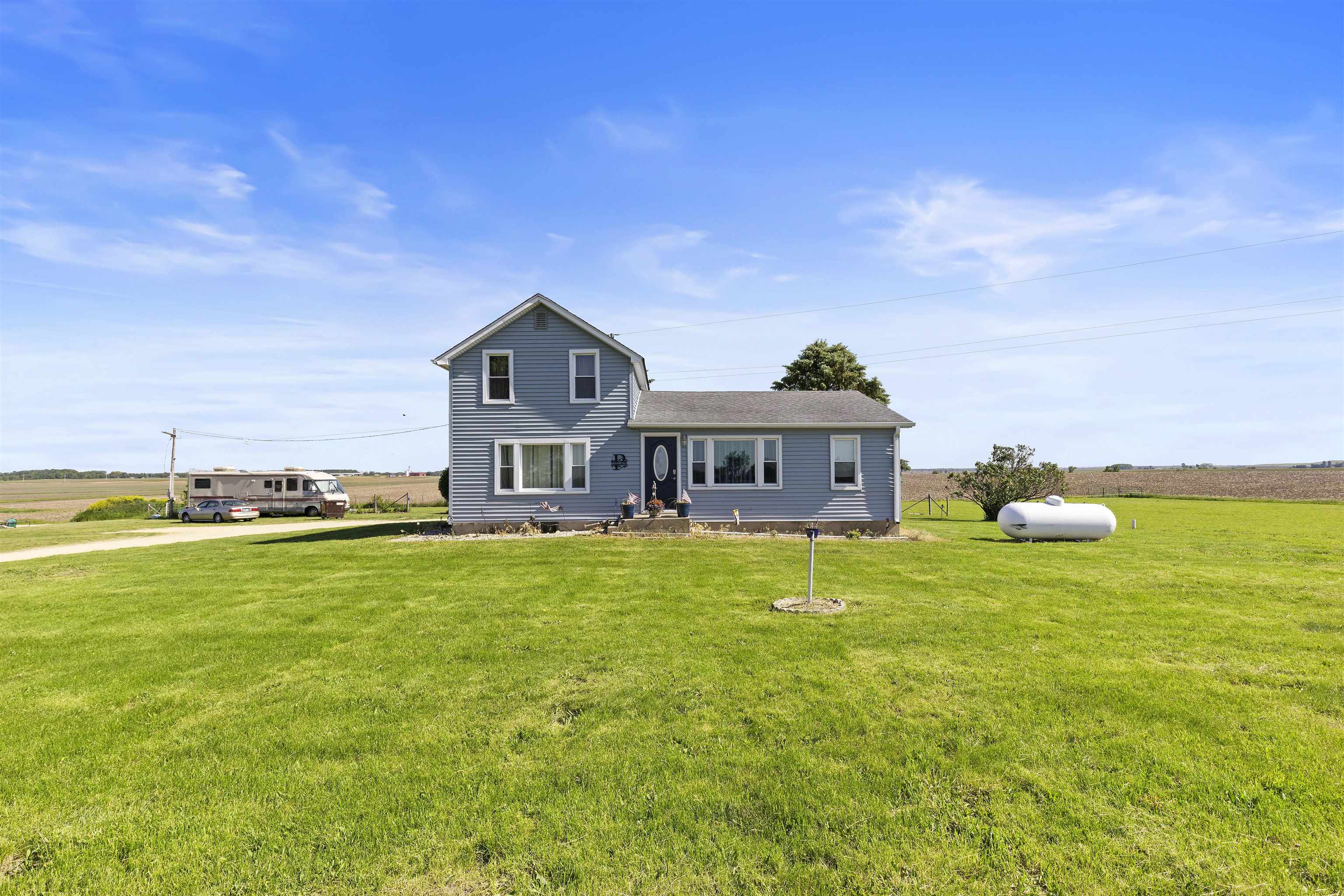 10784 East Utility Road Stillman Valley, IL 61084 - Photo 2 of 23 a front view of a house with garden